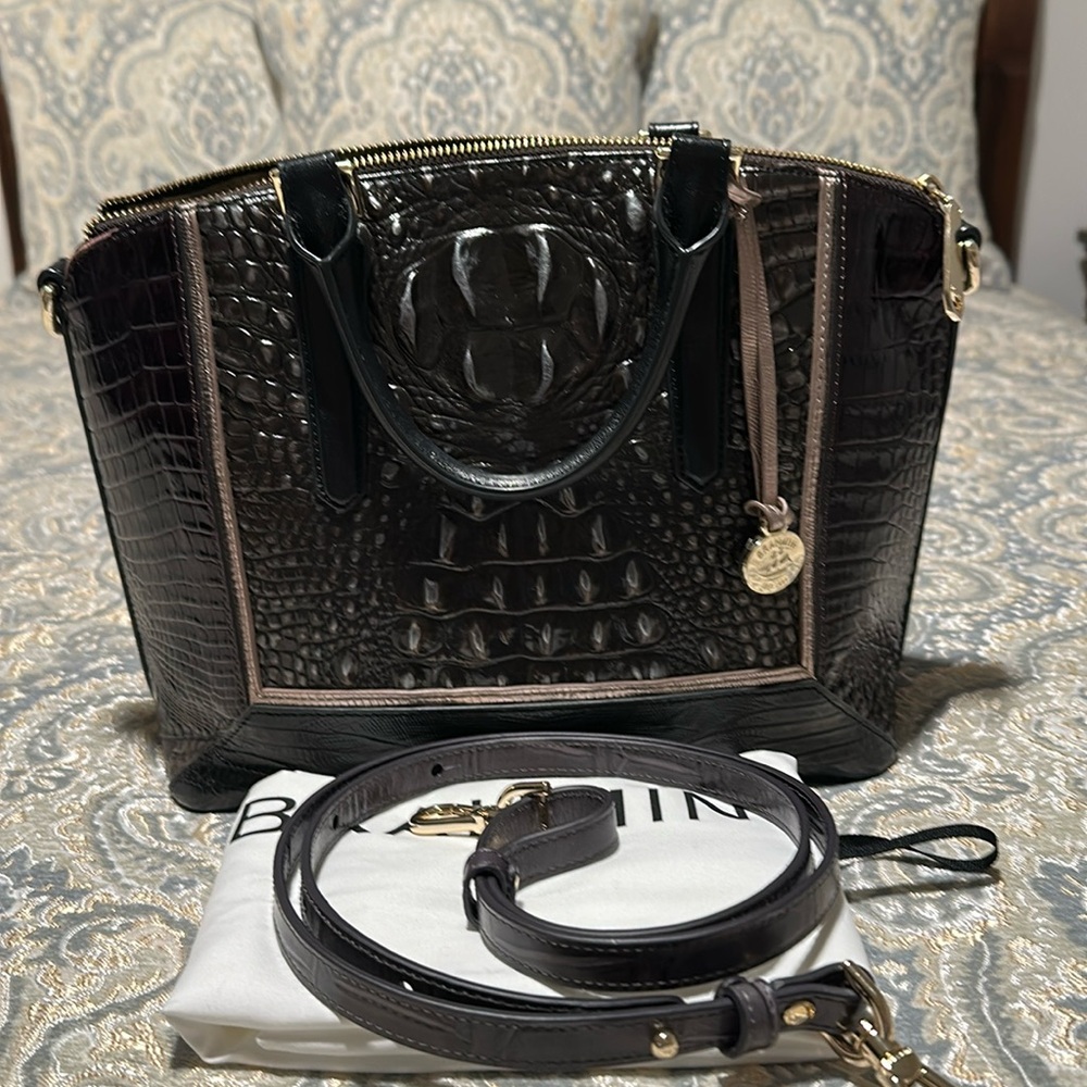This Brahmin handbag is a medium Duxbury .  It is a used handbag .